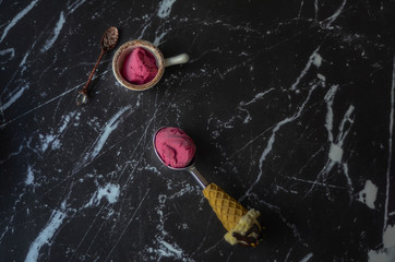 Healthy homemade raw vegan berry ice cream with big scoop