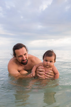 A Father and Baby Swimming