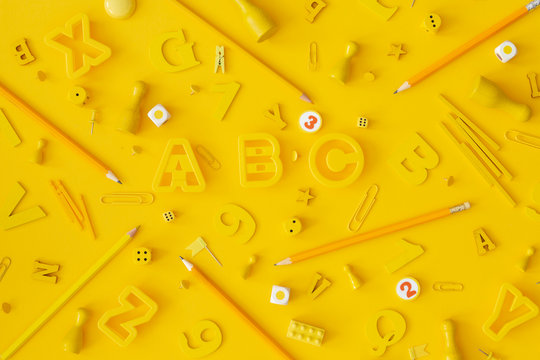 Yellow school objects on yellow background