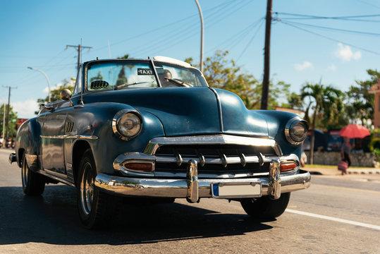 Blue old car running in the streets of Havana Cuba.