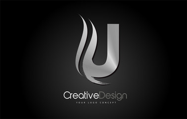 Silver Metal U Letter Design Brush Paint Stroke on Black Background © twindesigner
