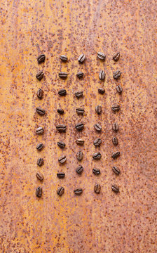 Coffee beans on rusty metal