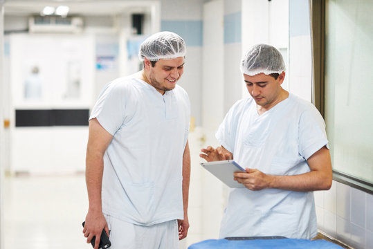 Medical professionals using a tablet