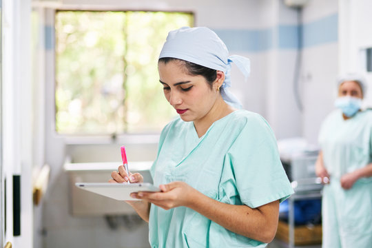 Doctor with stylus and tablet