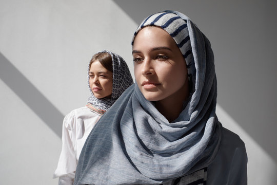 Portrait of two women wearing hijabs