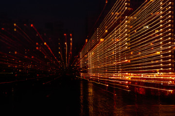Fototapeta na wymiar night city in motion of light lines