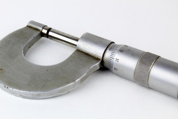 Old mechanical micrometer. A tool for accurate thickness measurement.