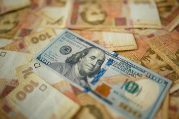 dollars euro hryvnia banknotes background, close up