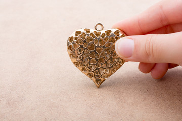 Heart shaped gold color metal object