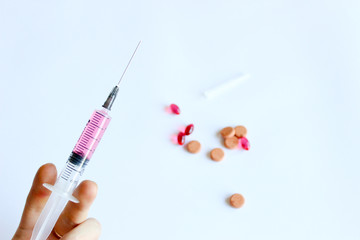 syringe with vaccine, vitamins