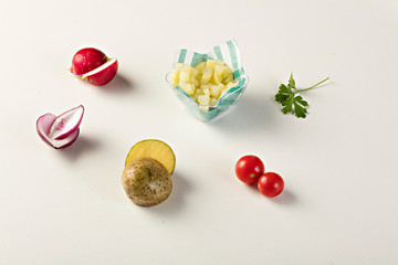 Ingredients, potatoes, onions, parsley, tomatoes, radish