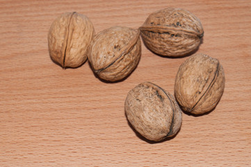 Walnuts on old rustic table in wooden bowl, Pile of Walnut kernels, Walnut background