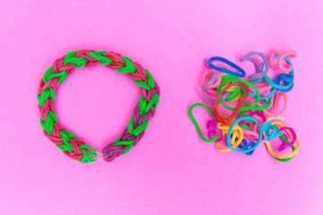 Chaos and order. Rubber bands for weaving loose and bracelet of rubber bands