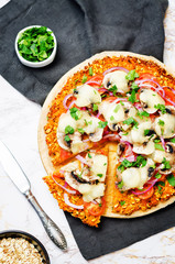 Sweet potato pizza crust with tomato, red onion and mushrooms