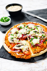 Sweet potato pizza crust with tomato, red onion and mushrooms