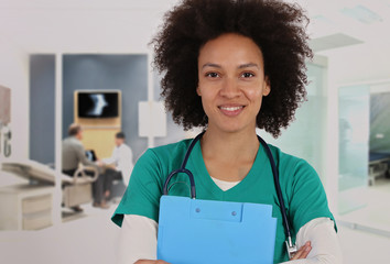 Woman nurse working in hospital portrait. Female healthcare worker with clipboard
