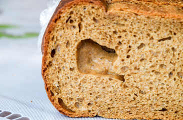 Rye bread with a large hole in the cut.