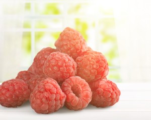 Raspberries on white background