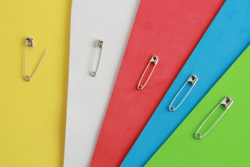 sewing pin on colorful background