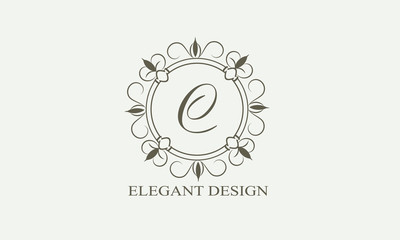 Fototapeta premium An elegant flower monogram with a letter. Elegant logo for menu design, labels, restaurant, hotel, heraldry, jewelry, boutique. Vector illustration.