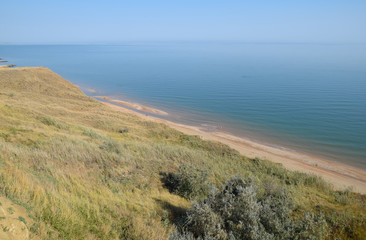 The hilly coast near the Sea of Azov. Clay rocks, a cliff on the shore