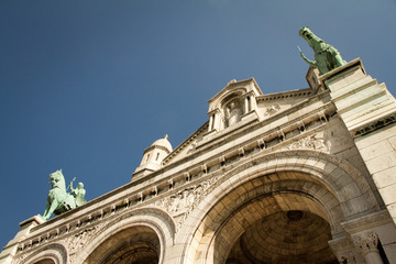 Details of an old Catholic cathedral, gargoyles, chimeras, arches, columns, sculpted facades.