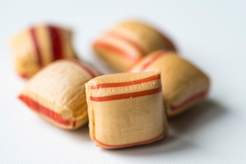 close up typical cinnamon candy cubes, kaneelkussen, from The Netherlands.