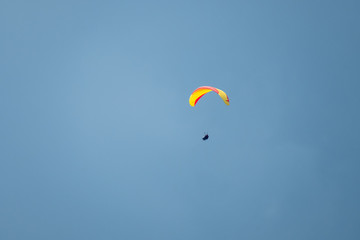 Tandem paragliders flying in the sky