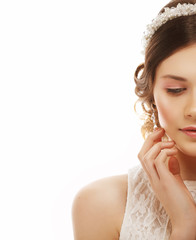 close up of beautiful woman wearing shiny diamond earrings