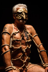nude bondaged man with venetian mask