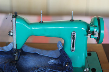 Vintage sewing machine. Concept for needlework and tailoring.