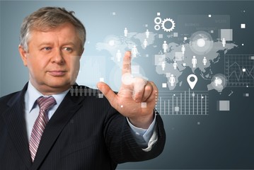 Businessman and internet and virtual reality concept - businessman pressing button on virtual...