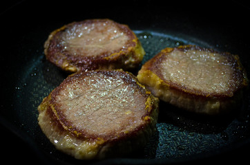 Roasted steaks on the grill. closeup