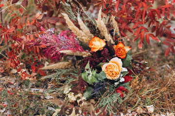 Wedding floristry in a yellow autumn meadow. 