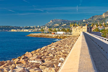 Fototapeta na wymiar Colorful Cote d Azur town of Menton breakwater and waterfront view