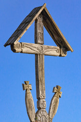 Wood carved orthodox cross with shingle roof protection