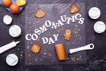 Text is Cosmonautics day and cookies in form of astronaut, rocket, flying saucer and alien.