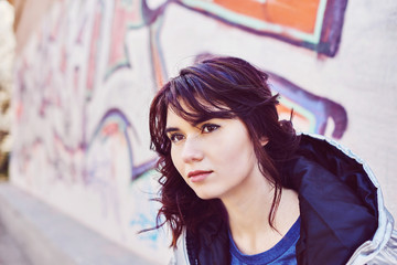 Young brunette walking in a park in spring