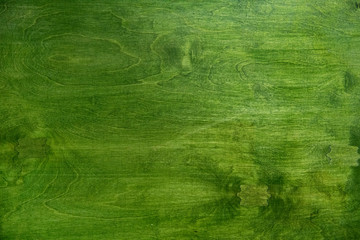 Naklejka premium Tło - blat drewniany, drewno pomalowane na zielono 