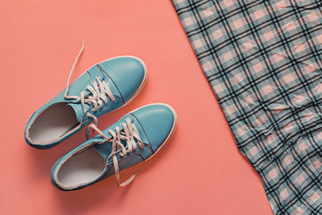 BLUE sneakers on a light pink background. FASHION COLOR 2019 PANTON. Women's boots. stylish BLUE sneakers