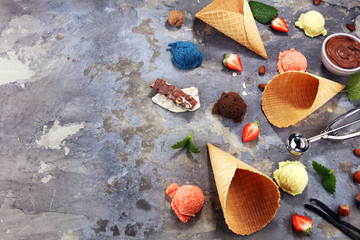 Set of ice cream scoops of different colors and flavours with berries and fruits
