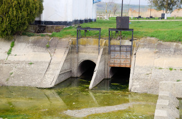 Gateway of a water pumping station. The message of two reservoirs. Hydraulic construction.