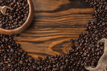 Atmospheric traditional coffee concept with wooden spoone and bowl, burlap Copy space