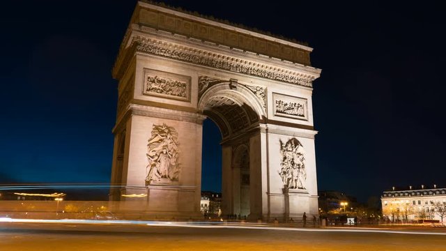 Arc de Triomph in Paris by night. This historical monument overlooks the avenue des champs elysees in the heart of French capital.