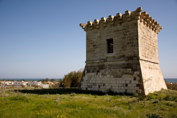 Details of  old historic tower in Cyprus and cloudy sky