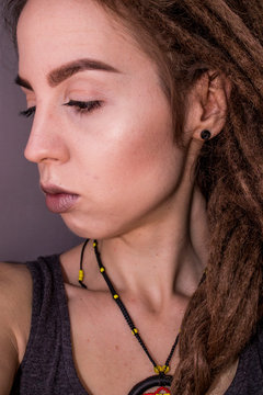 dreadlock girl with dreads and rastaman earrings