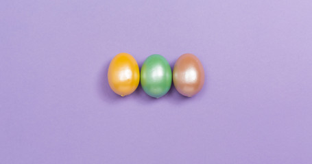 Decorated Easter eggs holiday theme on a purple background