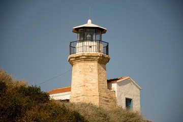 Old historic lighthouse in Cyprus and sky 