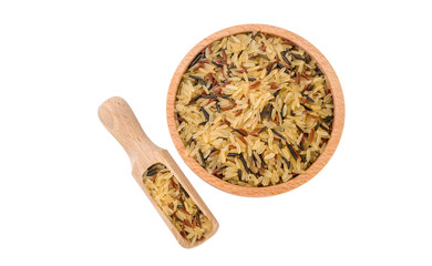 rice mix in wooden bowl and scoop isolated on white background. nutrition. bio. natural food ingredient. variety of white parboiled,red and wild rice.top view.