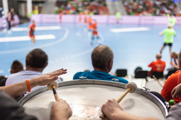 Supporters drum during handball match. - obrazy, fototapety, plakaty